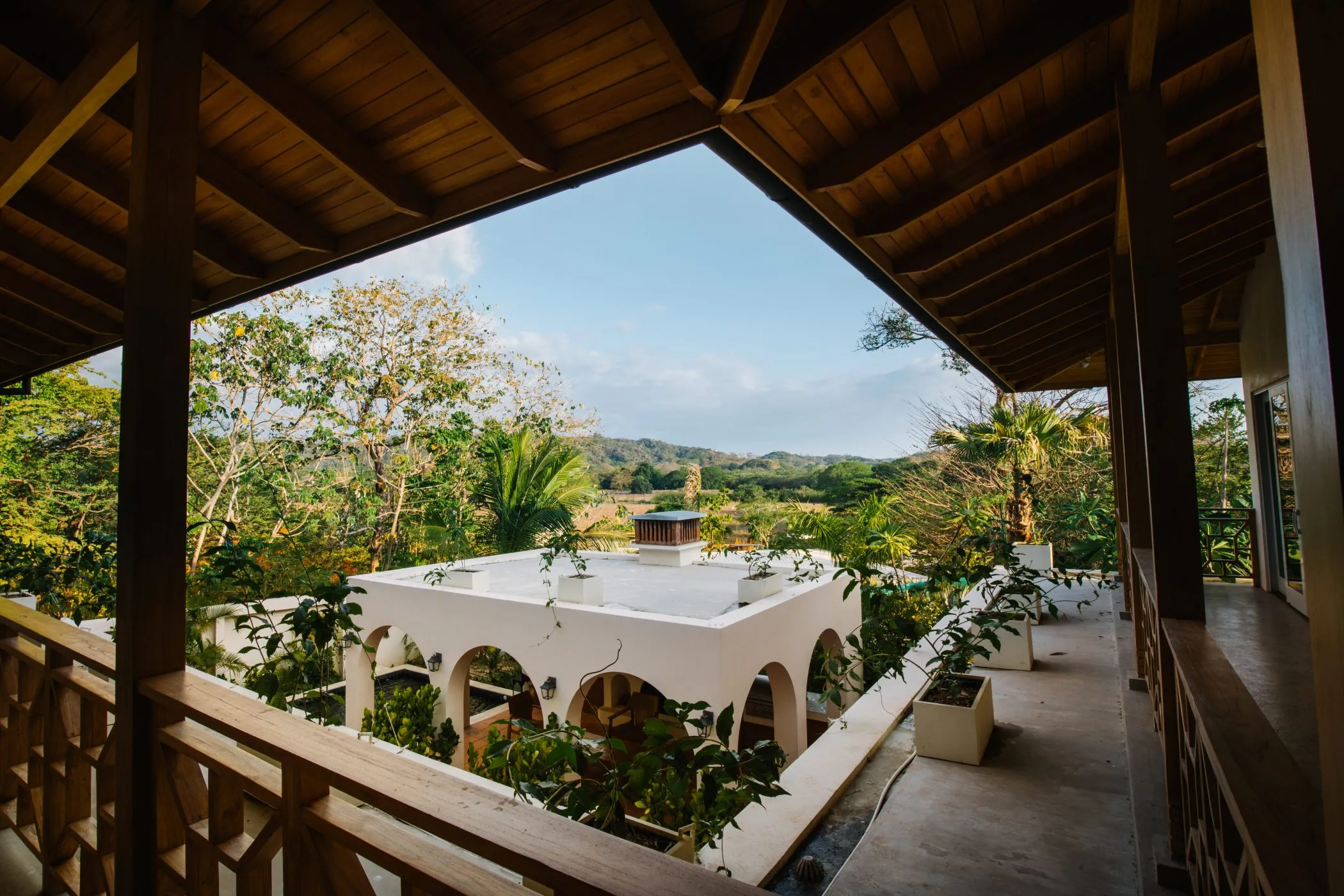 Casa Oceanus villa covered porch with countryside views toward the horizon, Guiones Beach Club Nosara