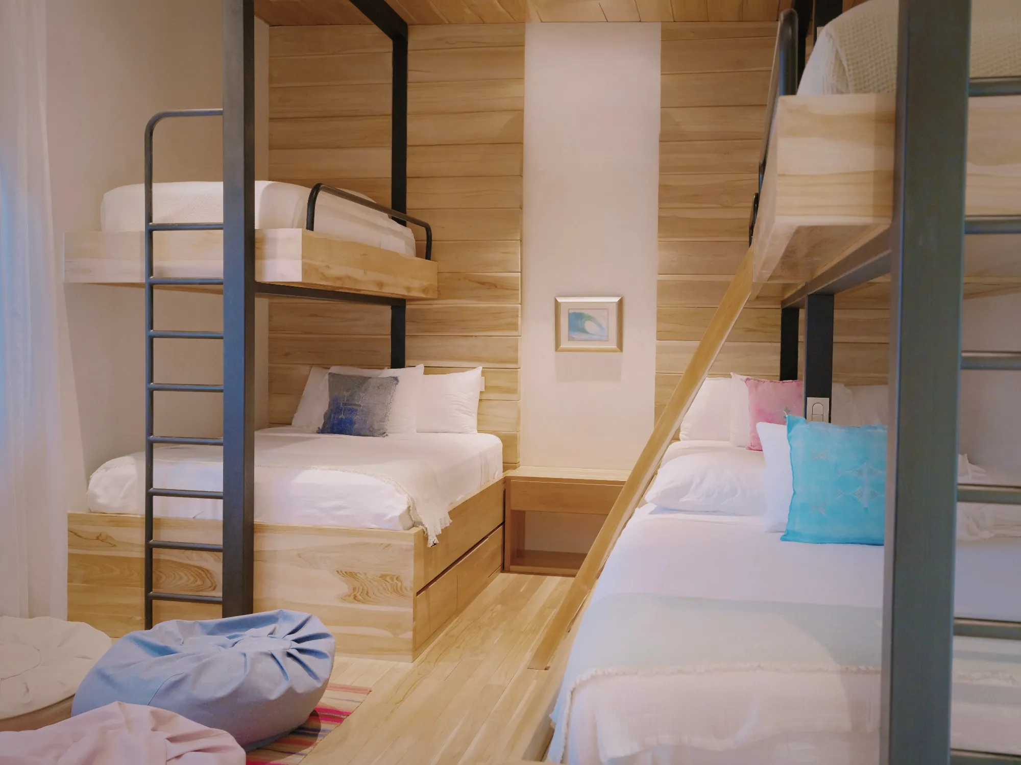 Tres Hermanas villa loft bedroom with twin loft above twin bed and steel ladder, Nosara