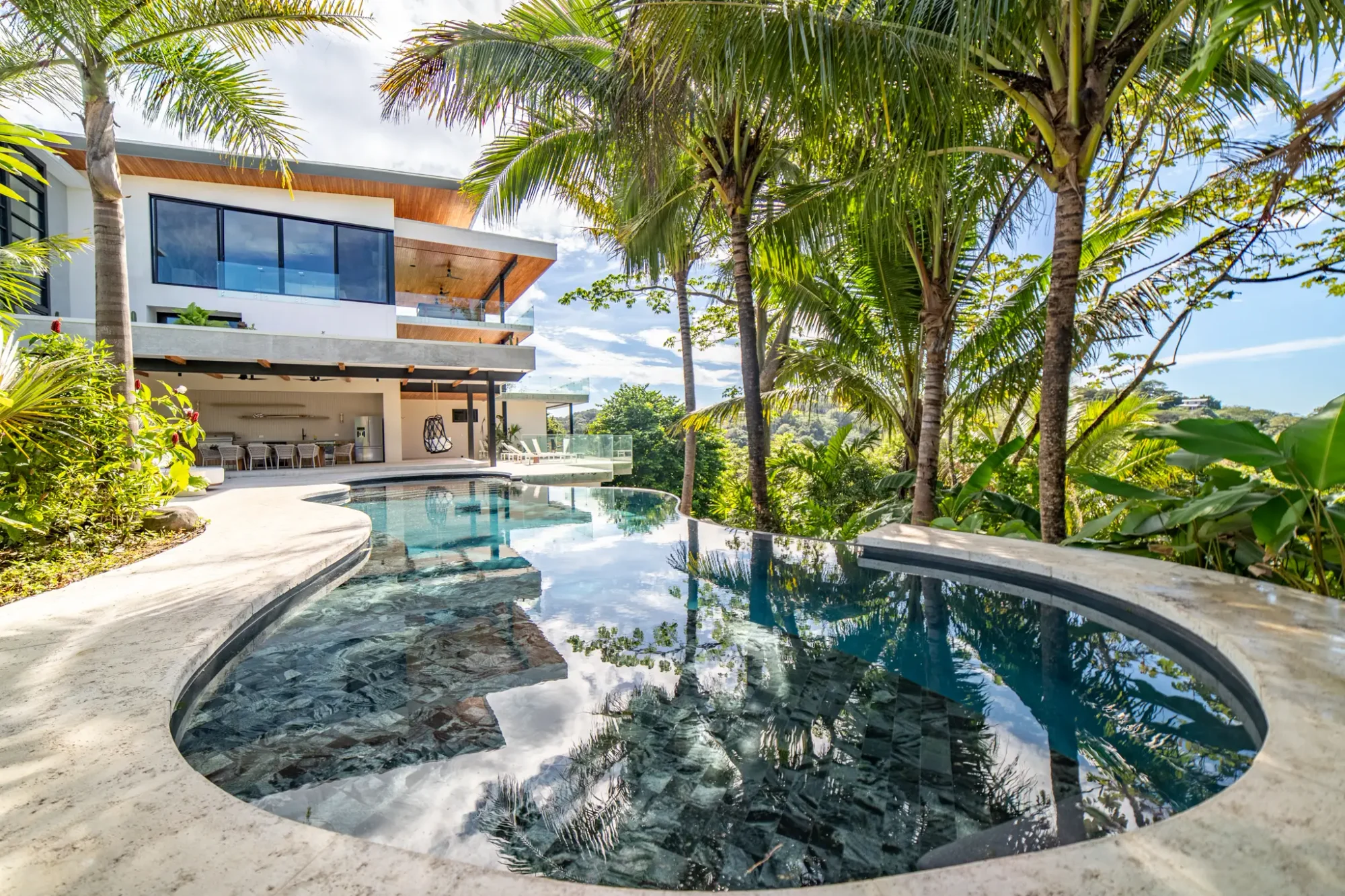 Casa Vivo villa pool with palm trees, hilltop Nosara, Costa Rica