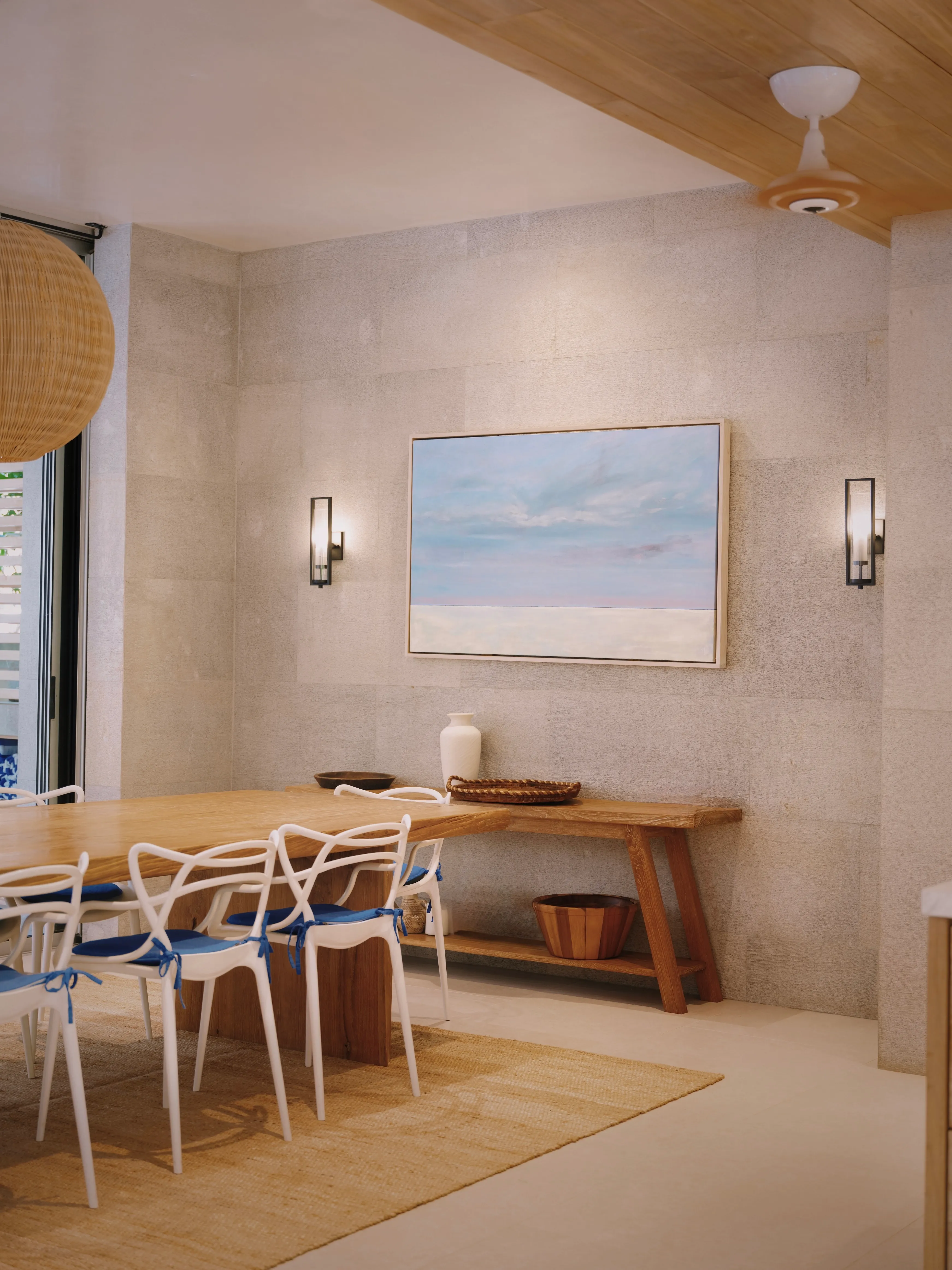Tres Hermanas villa dining area with table and chairs against neutral wall, Playa Guiones Nosara