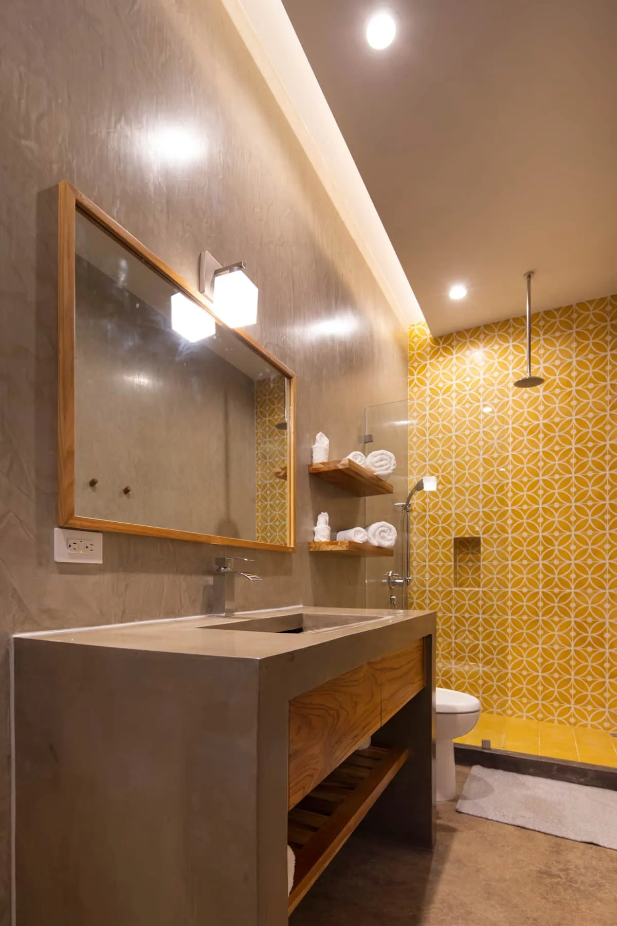 Terrace House villa bathroom with floating vanity and yellow tile, South Guiones Nosara