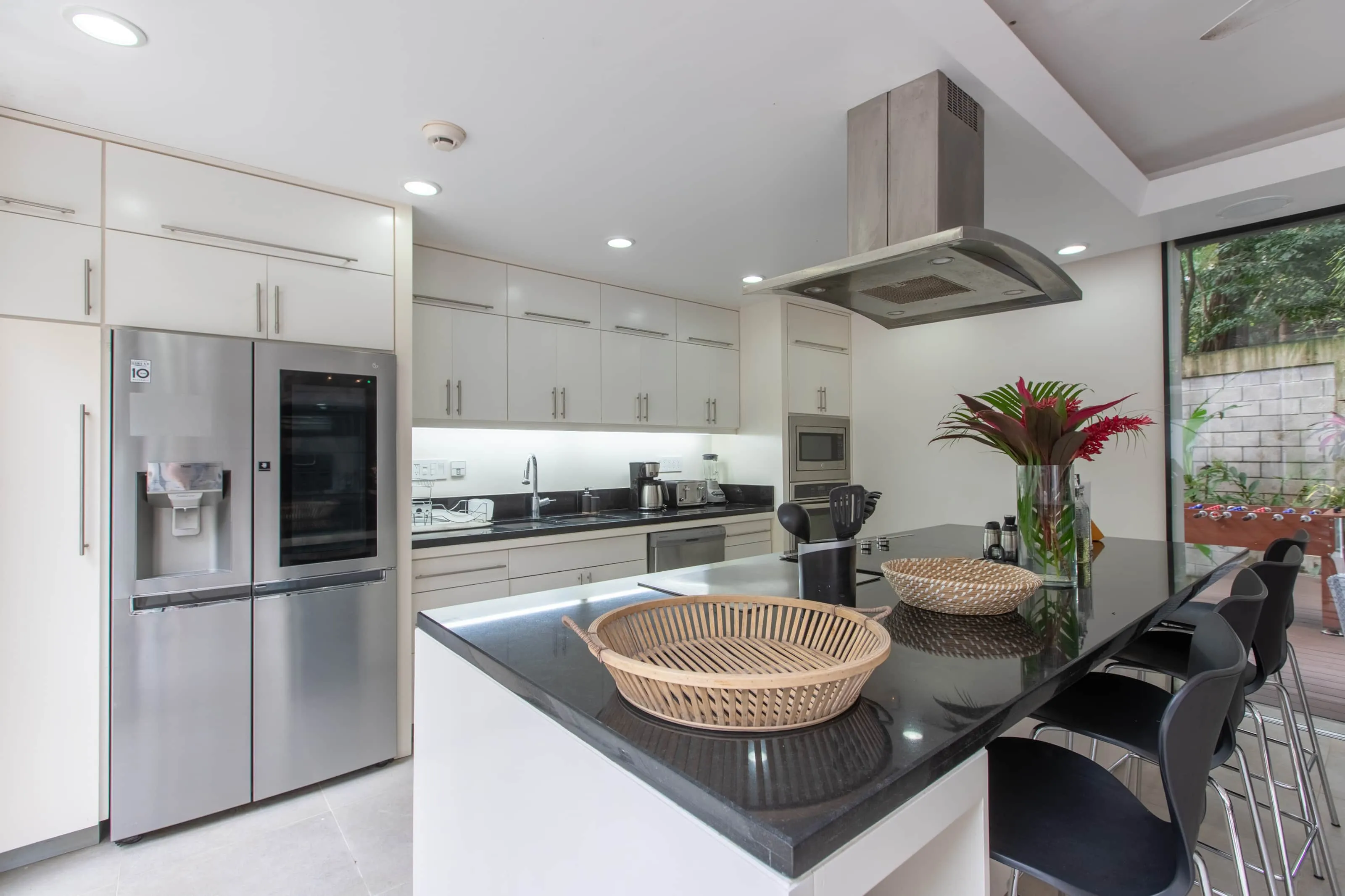 Casa Almendra villa modern kitchen with stainless appliances and central island, K Section Nosara