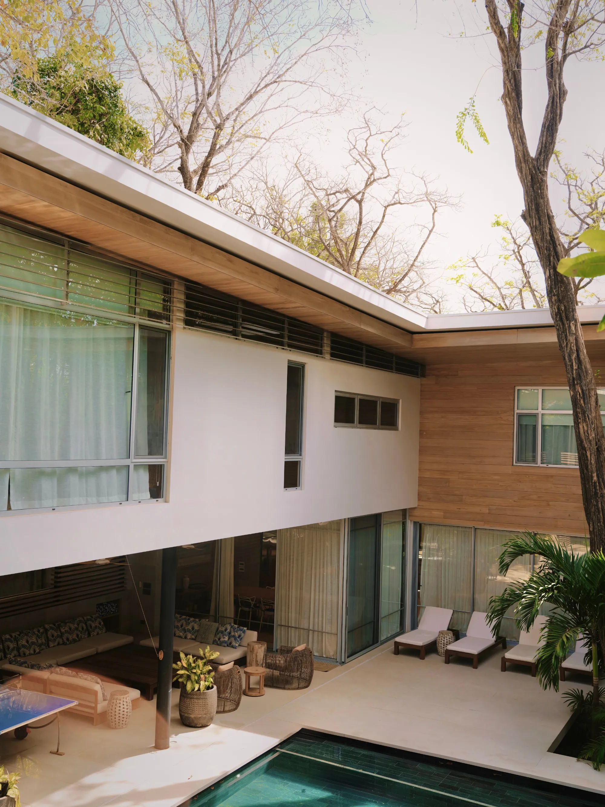 Tres Hermanas villa back exterior with pool and entertainment deck, Playa Guiones Nosara, Costa Rica