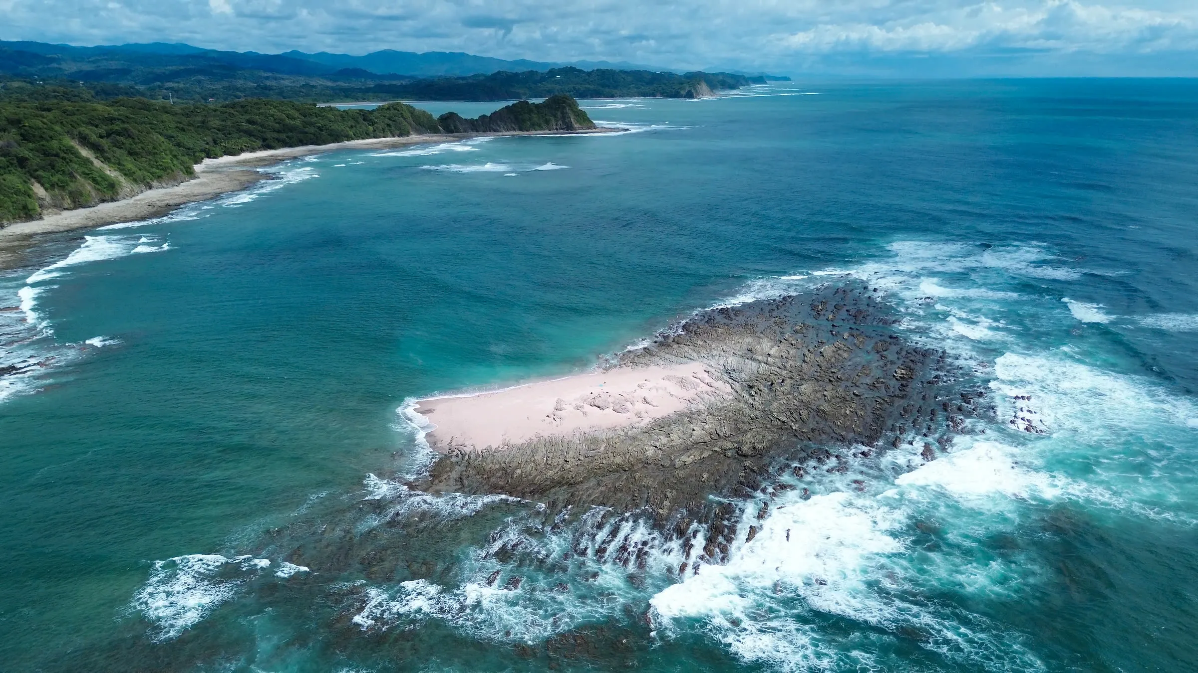 Aerial of the pink-sand island spit off the Nosara coast, Costa Rica